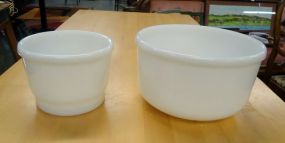 Two White Mixing Bowls Two white mixing bowls 5"h and 4"h.