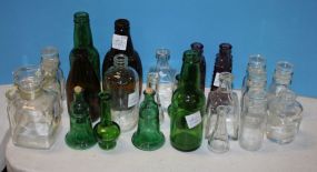 Large Group of Clear Glass, Colored Glass Bottles and a Decanter Large Group of Clear Glass, Colored Glass Bottles and a Decanter; large 7" h., smallest 3 1/4" h., twenty-three pieces total