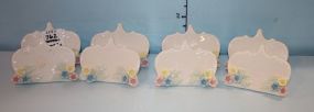 Set of Eight Porcelain Place Card Holders Set of Eight Porcelain Place Card Holders; with pastel hand painted flowers; 2" h., 2 3/4" w.