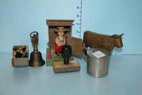 Small Brass Bell, Bronze Cow, Rubber Stamps, Pewter Condiment, and a Young Farmer in the Outhouse Small Brass Bell, Bronze Cow, Rubber Stamps, Pewter Condiment, and a Young Farmer in the Outhouse