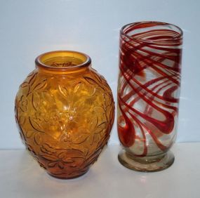 Amber Colored Glass Vase and a Clear and Red Swirl Glass Vase Amber Colored Glass Vase 5" dia., 13" h. and a Clear and Red Swirl Glass Vase 6" dia., 14" h.