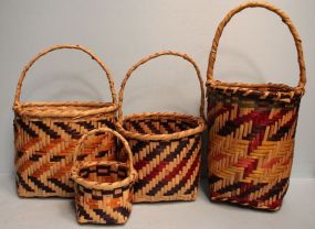 Four Choctaw Baskets Four Choctaw Baskets, with handles, sizes (10" h., 12" w.) (7" w., 13" h.) (17" h., 7" w.) (8" h., 4" dia.)