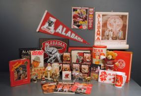 Alabama Football Collectibles - Amazing Collection Description: Includes 1973 Champion tag and metal 1964-65 champions tag. Also rare Bear Bryant Golden Flake tin and many more items.