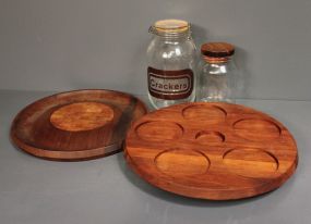 Two Glass Jars and Two Wooden Trays Description: Two Glass Jars (11"h and 8" h.) and Two Wooden Trays( one is lazy susan style)