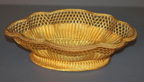 Gold Colored Metal Wire Basket Description: Gold Colored Metal Wire Basket, oval shaped 14" l., 9 3/4" w., 4" h.