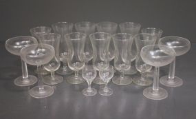 Set of Seventeen Clear Stemmed Glasses Description: Set of Seventeen Clear Stemmed Glasses; four (6" h.), seven (5 1/2" h.), four (5" h., monogrammed "A"), two (3" h.)