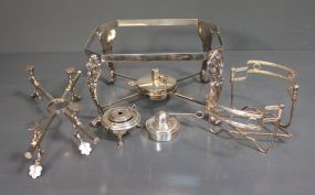 Group of Casserole Stands and Burners Description: Group of Casserole Stands and Burners, casserole stand with burner (Silverplate 7" h., 11" w.), plate stand (WA) Silverplate, English bowl carrier (ornate, Silverplate), two Silverplate burners