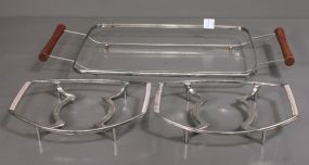 Two Corningware Stands and a Wooden Handled Casserole Stand Description: Two Corningware Stands and a Wooden Handled Casserole Stand