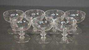 Set of Seven Cut Glass Champagne Glasses Description: Set of Seven Cut Glass Champagne Glasses; 3" h.