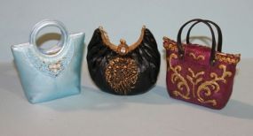 Three Resin Miniature Purses Description: Three Resin Miniature Purses, blue black and red. 2 1/2" h.