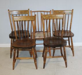 Five Spindle Back Chairs Description: Five Simple spindle back Chairs with gold accent pain on back. 33
