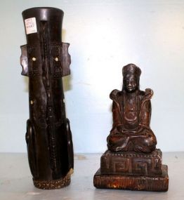 Tibetan Carvings Hand carved wood Buddha, 5" w., 9" h. ; hand carved wood Tiki figurine with mother of pearl accents, 12 1/2" h.