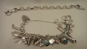 Two Sterling Lady's Charm and Link Bracelets Two Sterling Lady's Charm and Link Bracelets; 2.285 ozt