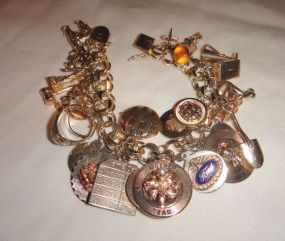 One stamped 10-14KT yellow gold lady's 8" charm bracelet One stamped 10-14KT yellow gold lady's 8" charm bracelet with 34 charms with a bright polish finish. Total Weight of With 34 Charms 75.90 dwt