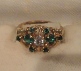 One stamped 14KT yellow gold lady&#39;s cast diamond simulant and emerald simulant filigree ring