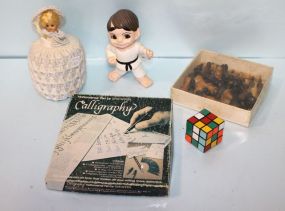 Vintage Doll, Calligraphy & Chess Pieces