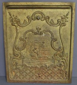  20th Century Iron Fireplace Cover Description: 20th Century Iron Fireplace Cover, front ornate design of children and mother; 20 1/2" w., 25" h.