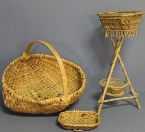  Three Baskets Description: Three Baskets, one on legs 27" h., one oblong 10" w., and one 22" dia.