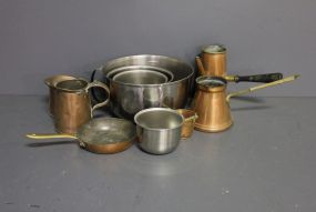  Stainless Mixing Bowls Description: Box lot of 4 stainless steel mixing bowls, 8", 6", 5", 4", also 6 pieces of small copper 5" skillets, small bucket, 2"h, 4 pitchers.