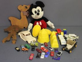  Group of Miscellaneous Toys Description: Large plastic container of toys, Mickey Mouse, model rolls royce (no wheels) lots of small tin race cars, model T, dump truck.