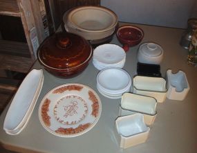  Group of Assorted Glass and Stoneware Items Group of Assorted Glass and Stoneware Items; approximately fourteen saucers and plates, five butter dishes, one glass covered jar and two stoneware dishes (one stoneware missing top)