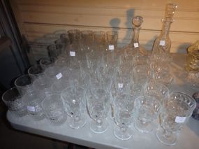  Group of Drinking Glasses along with Two Decanters Group of Drinking Glasses along with Two Decanters; Assortment of whiskey and water glasses, one whiskey glass has a crack
