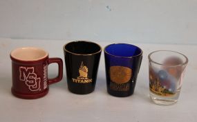  Three Jiggers and One Miniature Mug Three Jiggers and One Miniature Mug; Titanic, Versailles, Magic Kingdom and MS State Mug; 2 1/2" h.