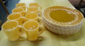  Gold Plates and Mugs Nine gold plates 10"w and eight mugs 3 1/2"h