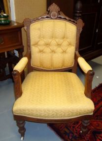  Walnut Victorian Parlor Arm Chair Walnut Victorian Parlor Arm Chair with porcelain casters; 40 1/2"h. x 24"w. x 25"d.