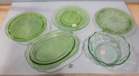  Six Pieces of Green Depression Glass Plate, Cake Stands, Two Plates, Oval Plate, and Bowl Six pieces of green depression glass 9 7/8" plate ; cake stands 10" ; two plates 7 7/8" ; oval plate 12" ; bowl 8 1/2"