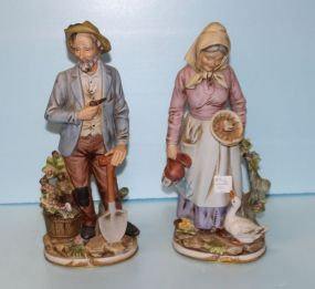  Pair of Bisque Painted Peasants 14" h., broken limp on gent