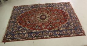 Tabriz hand knotted wool rug with red field; 4' 11" w., 6' 4"