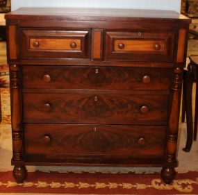 Empire cherry chest. Empire cherry chest with five drawers, columns, bun feet; 43" w., 20" d., 44" h.