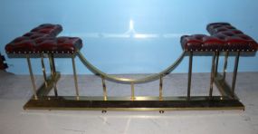 Brass and red leather fireplace seat; 59 1/2" length, 20 1/2" w., 18 1/2" h.