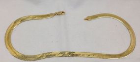 One Stamped 14KT Yellow Gold Lady's Cast and Hand Assembled 7mm wide, 16" long Herringbone Necklace