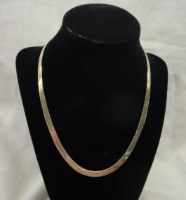 One stamped 14KT yellow gold lady's combination cast and machine made 5.5mm, 18" long Herringbone necklace