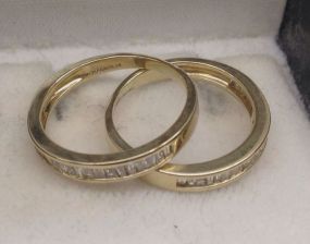 Two 14KT yellow lady's cast diamond anniversary bands
