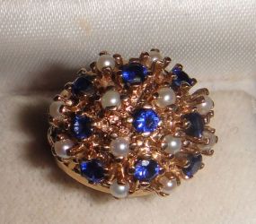 One 10-14KT yellow gold lady's cast sapphire and pearl cluster ring