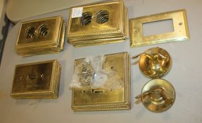Thirty-four Pieces of Brass Wall Plates