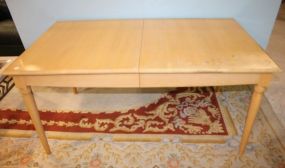 Blonde Wood Table Has two 18" leaves, matches lot #502; 64" w., 38" d., 30" h.