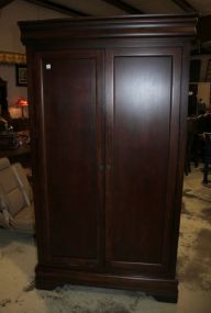 Mahogany Double Door Entertainment Cabinet Has two drawers inside; 43" w., 23" d., 76" 1/2" h.