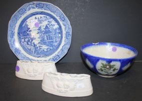 Group of Pottery Two German bisque flower holders 6"w., 2"h., and early ceramic oriental bowl (chip on rim) 7"dia., early 9" blue and white stoneware plate (age crack).