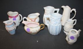 Group of Bisque and Porcelain Pitchers 2"- 4"h.
