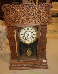 Victorian Eared Oak Mantel Clock Victorian eared oak mantel clock with gold etching of egret. 14"w., 22"h.