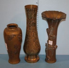Three 19th Century Brass Vases Oriental motif brass vase with bird on limb, 10" h., Bird on limb with fan out top, 12 1/2" h., Floral with leaves, 14" h.
