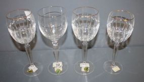 Four Waterford Glasses Three Grenville goblets (gold rim) one carelton platinum goblet 8"h.
