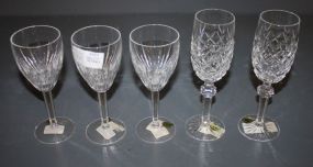 Five Waterford Glasses Three carina claret 7"h., two powers court flutes 8"h.