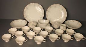 Partial Set of Narumi China Narumi china consisting of fifteen cups, serving bowl and under plate, two sugar bowls, two 9" serving bowls, two 12" plates, creamer, 24 pieces total