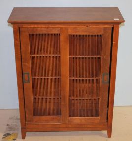 Small Sliding Door Cabinet has two shelves; 26" w. x 33" h.