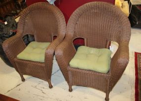 Two Brown Wicker Arm Chairs 29" w., 20" d., 37" h.